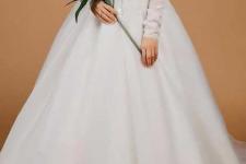 تصویر بند انگشتی لباس عروس آستین دار یقع خشت در مزون لباس عروس دیبا